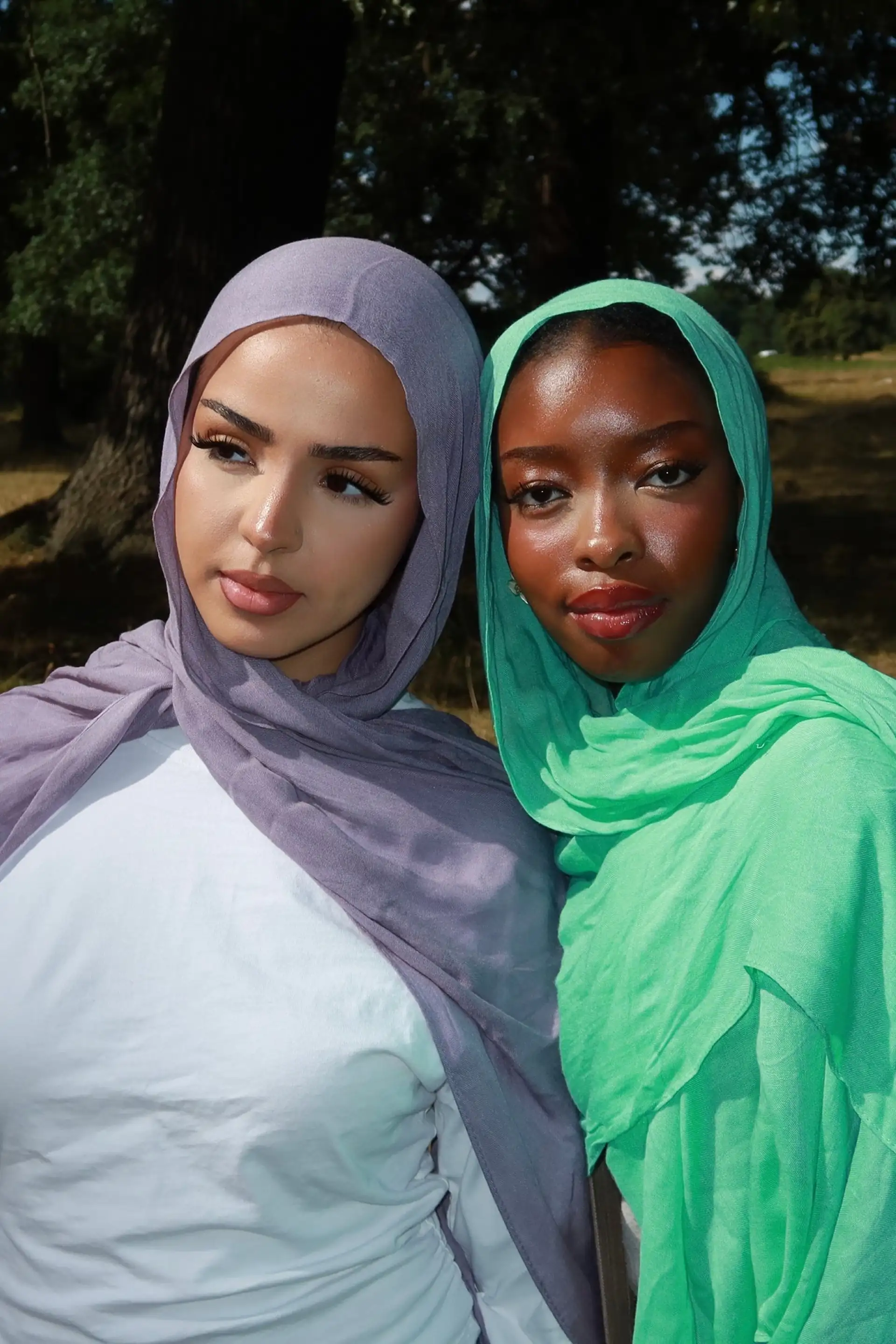 Two women wearing the Lilac Bloom and Blue Lagoon modal hijabs
